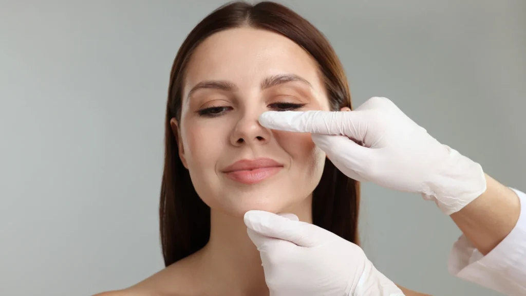 Patient checking a rhinoplasty surgeon's professional credentials, hospital information and qualifications before booking treatment in Turkey.